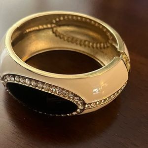 Enameled bracelet with rhinestones.